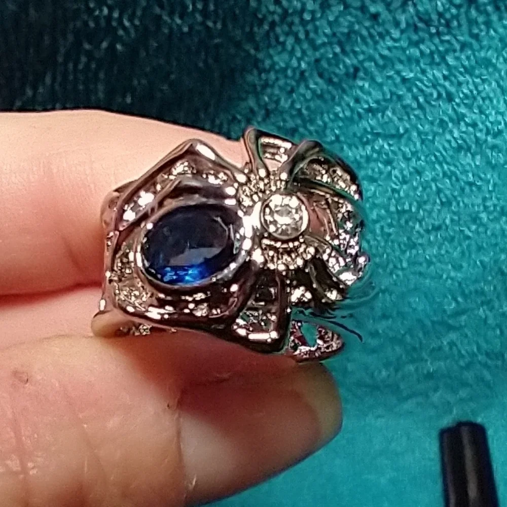 Silvertone spider web ring blue stone